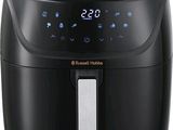 a close up of a black air fryer on a white background