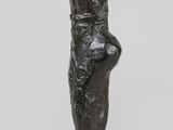an image of a sculpture of a woman ' s foot on a black base