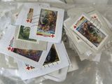 a pile of stamps sitting on top of a plastic bag