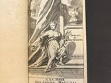 an open book with a drawing of a woman sitting on a chair