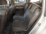 the back seats of a car are empty and the passenger seat is empty