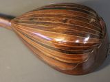 a close up of a wooden instrument on a table