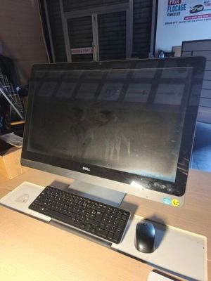 a computer on a desk with a keyboard and mouse