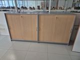 a kitchen with a counter and a refrigerator in it