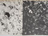 two black and white prints on the wall next to each other