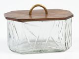 a glass container with a wooden handle on a white background