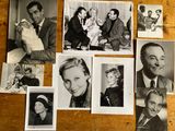 several old black and white photos of people sitting on a table