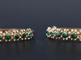 pair of emerald and gold hoop earrings