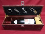 a wooden box with a bottle of wine inside of it