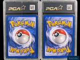 two packs of pokemon cards in plastic cases on a black background