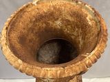a very old vase that is sitting on a table
