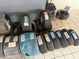 a lot of tires on the floor next to each other