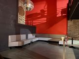 an image of a living room with a couch and stairs