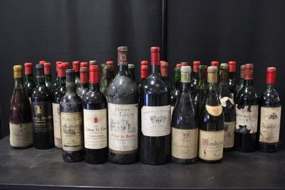bottles of wine are lined up on a table in front of a black backdrop