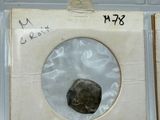 four different types of rocks in a display case