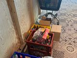 many bottles of water and bottles of soda in baskets on the floor