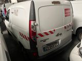 a white van that is parked in a parking lot