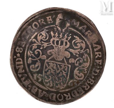 a close up of a coin with a coat of arms on it