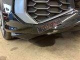 a close up of a car ' s grille with a sticker on it