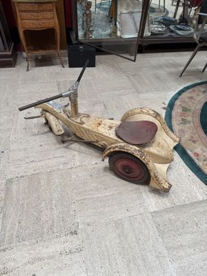 a small toy car that is sitting on the floor