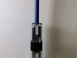 an image of a vacuum cleaner with a blue handle on a white surface