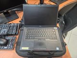 a laptop computer sitting on top of a desk next to a keyboard and mouse