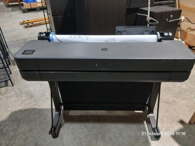 an image of a printer sitting on top of a table in a warehouse