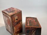 two pieces of wood are sitting next to each other on a white surface
