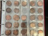 a lot of coins in a clear box on a table