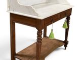 a marble top desk with a shelf underneath it