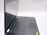 a laptop with a keyboard and a pen sitting on top of it