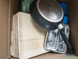 a box with a pan and other items inside of it