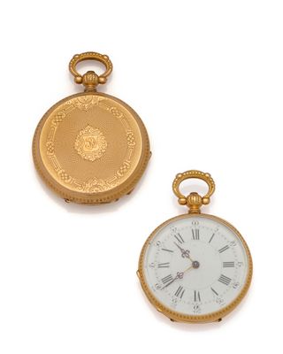 two different types of pocket watches on a white surface