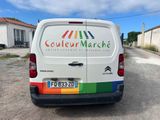 a white van that is parked on the side of the road