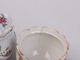 a small bowl and a small bowl sitting on a table
