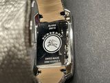 a close up of a wrist watch with a leather band