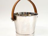 silver ice bucket with leather handle on white background