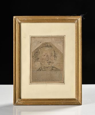 un dessin représentant le visage d'un homme, encadré dans un cadre doré