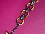 a close up of a metal chain with a lock on it