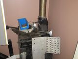 a stove with a metal pan on top of it in a room