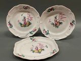 three plates with different designs on them on a table