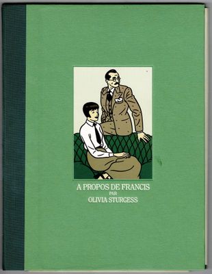 un livre vert sur lequel figure la photo d'un homme et d'une femme assis sur un canapé