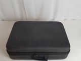 an image of a black case sitting on top of a white table
