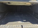a trunk of a car with the back door open