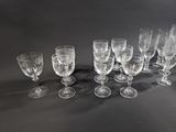 several empty wine glasses are lined up on a table