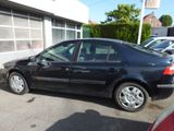 a black car parked in front of a building