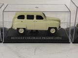three model cars in a display case on a white surface