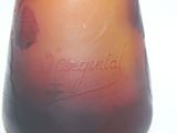 an image of a glass vase with a name etched on it