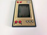 a small electronic device sitting on a white surface
