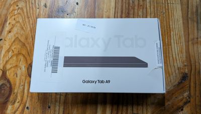 the box is open on a wooden table with a wooden floor